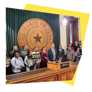 Community groups, local electeds, faith leaders, and labor partners standing in solidarity against HB 2127 with signs.
