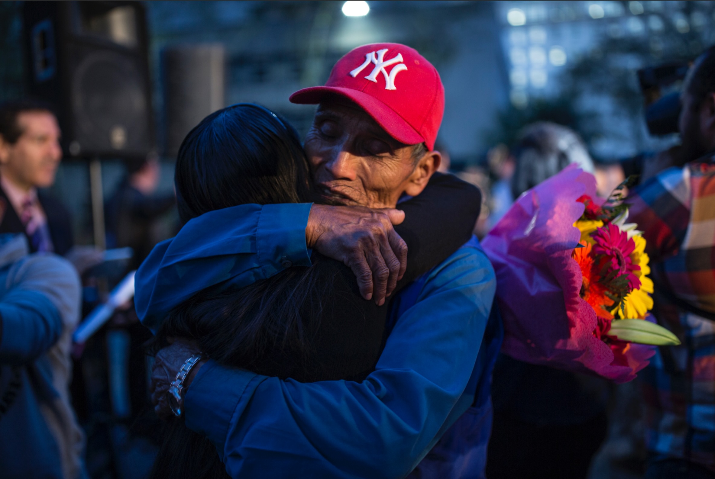 Two people passionately hugging one another, in what looks like a welcoming embrace after they have't seen one another in a long time. Photo credit: Griselda San Martín, Documented